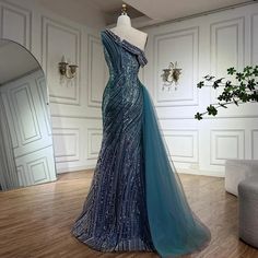 a dress is displayed on a mannequin in a room