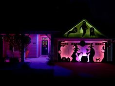 a house decorated with halloween decorations at night