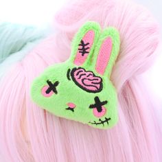 "Add a touch of quirky charm to your hairstyle with our Plush Anime Style Kawaii Zombie Bunny Hair Clip! Crafted from vibrant bright lime green minky fabric, this adorable hair clip features a sweet-faced bunny with hot pink brains and stitches embroidered using the highest quality threads. Each detail is meticulously crafted from a design drawn and digitized by me, ensuring a unique and eye-catching accessory. Handmade with love in the USA, this super cute zombie bunny hair clip is perfect for those who love to stand out from the crowd. Whether you're attending a cosplay event, Halloween party, or just adding a playful twist to your everyday style, this hair clip is sure to make a statement. Don't forget to check out the matching earrings available in my shop to complete your look! Be the Gurokawaii Fashion, Zombie Accessories, Zombie Cute, Kawaii Zombie, Bunny Hair Clip, Zombie Bunny, Goth Rockabilly, Kawaii Monster, Zombie Lover