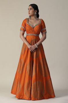 Burnt orange anarkali featuring foil printed mandala motifs, pleated bodice embellished by sequins and shell tassels. Comes with fringe lace lined dupatta. - Aza Fashions Orange Chanderi Anarkali Set With Cutdana, Orange Salwar Kameez With Cutdana For Navratri, Semi-stitched Orange Cutdana Anarkali Set, Designer Orange Sharara For Navratri, Orange Chanderi Anarkali Set For Navratri, Orange Cutdana Churidar For Eid, Orange Anarkali Kurta With Gota Work, Designer Orange Salwar Kameez With Gota Work, Anarkali Orange Sharara With Zari Work