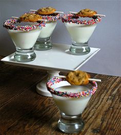 three desserts are on a tray with sprinkles and cookies in them