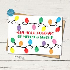 a christmas card with colorful lights on it that says, may your holiday be merry and bright