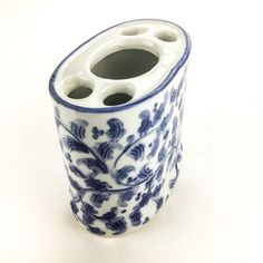 Lovely scrolling flower design on this cool brush holder. Hand painted  with decorative cobalt blue over white. Made in Thailand by Andrea Sadek. Ceramic Toothbrush Holder, Flower Makeup, Makeup Brush Holder, Pottery Crafts, Makeup Brush Holders, Brush Holder, Clay Ceramics, Makeup Brush, Toothbrush Holder