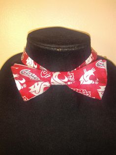 "This pre-tied and self-tie adjustable size bow tie is a perfect accent for any collared shirt! This bow tie can fit a child as young as three years old up to an adult with an 18\" neck size, even a dog or cat! *Finished print layout may vary from featured photo. **This is not a licensed product. Please note for UW, WSU, and Oregon bow ties- fabric prints have been updated as of May, 2020 The bow ties will be made with the new logo print fabrics featured in the photo next to the finished bow tie Adjustable Dapper Ties With Bow Tie Back, Pre-tied Butterfly Knot Bow As Gift, White Adjustable Bow Tie Suit Accessories, Red Adjustable Bow Tie With Bow Tie Back, Adjustable Pre-tied Bow Tie For Black Tie Events, Adjustable Pre-tied Bow Tie For Black Tie Occasion, Adjustable Red Bow Tie With Bow Tie Back, Adjustable Butterfly Knot Bow Tie For Black Tie Events, Adjustable Dapper Tie For Black Tie Occasions