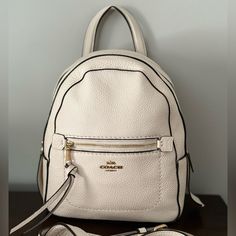 Coach Backpack, Never Used, New With Tags! Cream Color, Comes With Removable Strap White Backpack For Errands, White Standard Backpack For Errands, White Standard Backpack, Leather Backpack With Zipper Closure In Cream, Cream Leather Backpack With Zipper Closure, Cream Backpack With Zipper Closure, White Coach Backpack For Travel, Luxury Leather Backpack In Cream, White Backpack With Detachable Strap For Errands