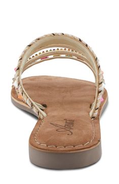 A cushioned footbed keeps you comfy in this beachy sandal topped with playful embellished straps. Cushioned footbed Leather and textile upper/leather lining/rubber sole Imported Beaded Open Toe Synthetic Sandals, Beaded Synthetic Open Toe Sandals, Embellished Summer Beach Sandals, Flat Synthetic Sandals With Beaded Details, Summer Beaded Synthetic Sandals, Casual White Beaded Sandals, Adjustable Embellished Sandals For Beach Season, Casual Embellished Sandals For Beach Season, Embellished Adjustable Sandals For Beach