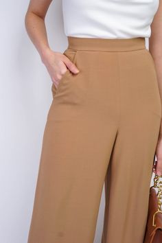 Elevate your wardrobe with the our Cheryl Pants in Dark Tan. Designed to be versatile for any occasion, these high-waisted trousers feature a straight-leg fit and center back zipper, and side pockets, these pants are perfect for work and special events, making them a staple in your elegant and sophisticated wardrobe. Size & Fit Model Measurements (Model is wearing Size 16) Bust: 45.5" Waist: 41" Hips: 47" Height: 5’7" Model Measurements (Model is wearing Size 0) Bust: 33" Waist: 26" Hips: 37" He Sophisticated Wardrobe, Cotton Box, Working Women, Dark Tan, Office Attire, Working Woman, Box Pleats, Work Office, High Waisted Trousers