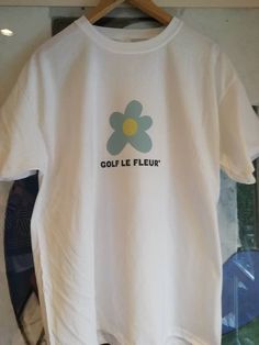 Golf le Fleur t.shirt printed on Fruit of the loom, long sleeve and short available. White T-shirt With Front Print For Spring, Spring White T-shirt With Front Print, White Graphic Tee Shirt With Front Print, White Long Sleeve T-shirt With Front Print, Summer Long Sleeve Logo Print T-shirt, Long Sleeve Logo Print T-shirt For Summer, Summer Long Sleeve T-shirt With Logo Print, Summer Long Sleeve T-shirt With Logo, White Pre-shrunk T-shirt For Spring