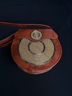 Unique African leather handbag with an elegant look and brilliant finish. Can be used during special events like dates, birthday parties, weddings, baby showers, proms and many other special occasions. Get yours today! Incase of any questions please let me know. We also custom make. Elegant Brown Flap Bag As Gift, Elegant Brown Flap Bag For Gift, Elegant Formal Handmade Satchel, Handmade Satchel Shoulder Bag For Evening, Handmade Brown Shoulder Bag For Evening, Handmade Evening Satchel Shoulder Bag, Gold Leather Satchel As A Gift, Handmade Formal Shoulder Bag, Handmade Gold Satchel Bag