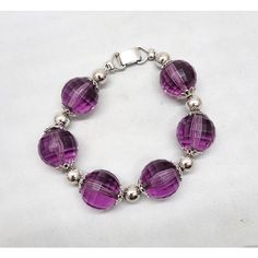 Early 1960s rhodium plated faceted purple resin beads with filigree detail terminals and round rhodium plated bead spacers and fold over clasp. Marked "NAPIER." Measures: 8 1/2 inches long by 3/4 inches wide. Interior circumference due to the thickness of the beads is about 7 1/4 inches. Excellent condition. Purple Resin, Resin Beads, Vintage 1960s, Fold Over, Beaded Bracelet, Rhodium Plated, 1960s, Beaded Bracelets, Bracelet