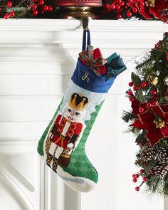 a christmas stocking hanging from a mantel