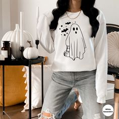 Halloween Sweater, Cute Ghost Shirt, Fall Sweatshirt, Halloween Crewneck, Funny Party Tees, Retro Sweater, Women's Spooky Hoodie 👉 Product Details: All Shirts are unisex and perfect for men or women. 👈 🌟 Please make sure you chose your desired style from the drop down menu and review the size chart to ensure you are ordering the best item from you. Most listings have various styles (Short Sleeve Crewneck T-Shirt, Short Sleeve V-Neck, Sweatshirts, Hoodies, Long-sleeve T-Shirt). Please make sur Halloween Sweatshirts Cricut, Cricut Sweaters, Spooky Hoodie, Cricut Clothing, Cricut Tshirt, Sweatshirt Ideas, Halloween Apparel, Cat Ghost, Halloween Crewneck