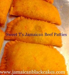 sweet jamaican beef patties on a baking sheet