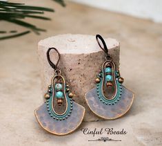 Bohemian Festival Earrings With Patina, Bohemian Patina Earrings For Gift, Bohemian Patina Earrings Gift, Adjustable Bohemian Patina Earrings, Bohemian Patina Earrings, Vintage Turquoise Beaded Drop Earrings, Turquoise Metal Beaded Bohemian Earrings, Bohemian Bronze Earrings With Round Beads, Bohemian Turquoise Beaded Earrings With Brass