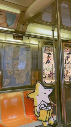 the interior of a subway car with cartoon characters on it