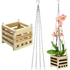 two wooden crates with flowers in them and one hanging from the chains on each side