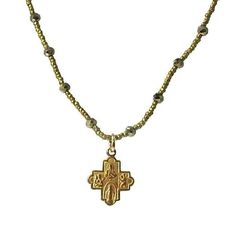 Tiny cross on gold Heishi seed pearls with stationed pyrite accents. Approx 18" Semi Precious stones Cross 3/8" long Cast bronze crosses and medals Hand Crafted in USA Gold Crucifix Necklace With Beaded Details, Gold Beaded Crucifix Jewelry, Spiritual Gold Necklaces With Tiny Beads, Spiritual Gold Necklace With Tiny Beads, Tiny Cross, Seed Pearl, Semi Precious Stones, Semiprecious Stones, Precious Stones