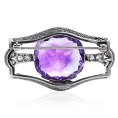 Meticulously crafted in platinum, this GIA-certified 1920s art deco amethyst brooch of dramatic presence will accentuate your best outfits. The large cushion amethyst of approximately 17.50 carats is held in a prong setting. Decoring the glamorous prongs are pavé settings, composed of (14) European round-cut diamonds, weighing approx. 1.20 carats (graded G-H color and VS clarity) that blend perfectly with the beautiful filigree frame at the back of the piece. The top of this piece measures 41.5 Art Deco Diamond Brooches With Gemstone, Diamond Gemstone Brooches In Art Deco Style, Elegant Purple Gemstone Brooches, Art Deco Platinum Brooches As Gift, Elegant Amethyst Brooches For Wedding, Art Deco Platinum Brooches In White Gold, Art Deco White Gold Brooch In Platinum, Art Deco White Gold Platinum Brooches, Luxury Purple Brooches For Formal Occasion