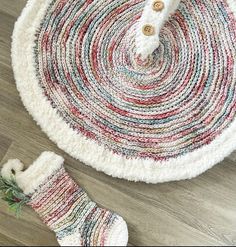 a pair of white socks sitting on top of a rug next to a wooden floor