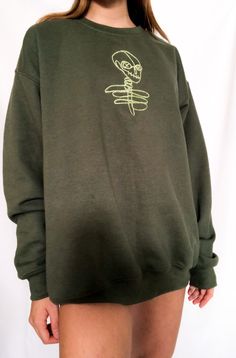 ✰Skeleton Scribble: Edgy n Cute! A BOXEDTRENDS Original✰Army Green✰UNISEX✰Hand drawn and designed✰Embroidered sweatshirt✰Super soft and comfy!✰Ships within anywhere from 1 day-2.5 weeks depending on inventory ✰Model is 5'5 and wearing Size L Casual Skull Print Sweater For Streetwear, Cotton Skull Print Relaxed Fit Sweatshirt, Relaxed Fit Cotton Sweatshirt With Skull Print, Skeleton Shoes, Embroidered Clothes, Embroidered Sweatshirt, Embroidered Sweatshirts, Stylish Shirts, Fashion Games