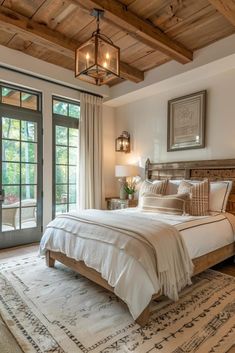 a bedroom with a large bed and french doors