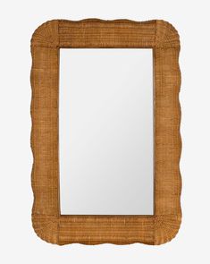 a mirror that is made out of wicker and has a square frame on it