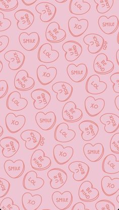 a pink background with hearts and the word smile on it's side, as well as