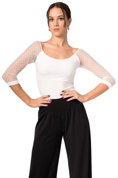 Argentine Tango dance top, 3/4 mesh sleeve blouse, Polka dot sheer lace sleeve top, Latin show blouse, Bodycon round neck blouse Blouse With Dotted Tulle Sleeves The perfect top for milongas, evening occasions, and everyday looks. It is made from a stretch jersey featuring 3/4 sheer tulle sleeves with small dots. This elegant top pairs well with various skirts and pants from our tango collection. Available in burgundy, black and off-white color.  Each color comes with the same color tulle sleeves.  Pair it with a black fishtail Tango skirt : https://www.etsy.com/listing/514064399/argentine-tango-skirt-latin-practice or with an Egyptian style skirt : https://www.etsy.com/listing/1376424302/egyptian-wrap-midi-skirt-modern-schenti Product code : TJ197 The model is 1.70 m (5'7'') tall and wear Casual Fitted Blouse With Mesh Sleeves, Summer Blouse With Stretch Mesh Sleeves, Fitted Elegant Mesh Blouse, Fitted Summer Top With Lace Sleeves, Fitted Summer Blouse With Lace Sleeves, Elegant Summer Tops With Mesh Sleeves, Fitted Lace Sleeves Blouse For Summer, Fitted Blouse With Lace Sleeves For Summer, Fitted Top With Lace Sleeves For Summer