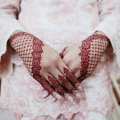 a woman with henna on her hands