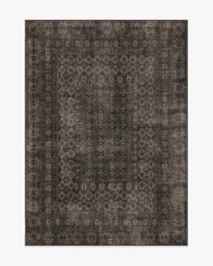 an area rug in dark brown and grey tones