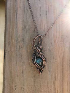 Just recently I got supplies and was able to play with oxidizing necklaces. This is one of the first four I oxidized, and I love how it turned out. The necklace has so much depth and detail. It looks like it has a story to it. It turned out so pretty and I am so excited to make more. This necklace is a labradorite stone wrapped in copper wire and oxidized. The chain is oxidized as well. Unique Patina Round Pendant Necklace, Spiritual Patina Copper Necklace, Unique Copper Necklace With Oxidized Finish, Artisan Copper Jewelry With Oxidized Finish, Unique Pendant Necklace With Patina, Spiritual Bronze Necklace With Patina, Bronze Spiritual Hand Wrapped Necklaces, Spiritual Bronze Hand Wrapped Necklaces, Oxidized Copper Pendant Necklace