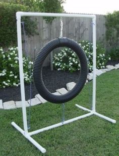 a bicycle tire is mounted to a white frame