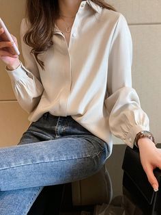 Made for the modern-day woman, this Elegant Gathered Sleeve Blouse will have you radiating some major classy vibes. Featuring a classic collar complete with a large button, covered front plaquette, and gathered sleeves, you’ll be looking graceful and refined from head to toe.This blouse pairs well with an array of bottoms including denims, solid leggings, or your favorite trousers to elevate your personal style. Classy Vibes, Plaid Jacket Women, Plus Size Fall Fashion, Checkered Jacket, White Shirts Women, Shirts Women Fashion, Solid Leggings, Blouse Casual, Gathered Sleeves