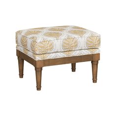 the foot stool is made from wood and has an upholstered pattern on it