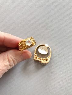 Super swanky PAIR of vintage 70's / 80's 18k / Kt heavy gold electroplate cubic zirconium / cz men's size 10 rings. One maintains the tag. Perfect for the gaudiest over the top wedding! In like new vintage condition. Size 10 Contact us with any questions, and please read our shop policies for full details. Vintage Gold Plated Wedding Rings, Unique Gold Signet Ring For Wedding, Unique Gold Topaz Ring For Formal Occasions, Vintage Gold-plated Gold Rings, Vintage Gold Plated Gold Rings, Vintage Gold Plated Rings, Hallmarked Gold Crystal Ring For Anniversary, Gold Hallmarked Crystal Ring For Anniversary, Gold Signet Ring With Stone Setting As Gift