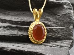 Gold Carnelian Necklace set with a Natural Carnelian (Red Agate) in a diamond cut & deep red color, at 10x8mm size (3 Cts) from Uruguay.Gold Vermeil: 18k Gold over Solid 925 Sterling Silver ☞ made to last. Matching Ring & Matching Earrings - please ask me Details:• Natural Carnelian sourced from Uruguay• Carnelian: 10x8mm, 3 Cts, diamond cut• Pendant Height 17mm, Width 8mm• Free Complimentary Chain• 18k Gold Vermeil❀ Each Natural Gem is unique & will have Slight variations from the product pictu Red Agate Necklace, Ring Matching, Victorian Pendants, Carnelian Necklace, Matching Ring, Victorian Gold, Necklace Red, Red Agate, Agate Necklace