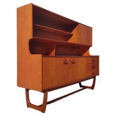 a wooden cabinet with two drawers on one side and an open drawer on the other