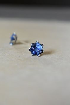 Sapphire earrings created with uncut sapphire set into my copyrighted lotus flower cup design and finally set on .925 sterling silver studs. September birthstone jewelry for mom, daughter or sister perhaps! Even Mothers Day gemstone jewelry in sapphire and silver. They are very light, sparkly and color-rich. Sapphire is September's birthstone. Scroll to read more. *Each piece is one of a kind. I place raw Sapphires mosaicly in a random way. No two are alike and will differ from the photos slight Sapphire Flower-shaped Jewelry Gift, Flower Shaped Sapphire Jewelry Gift, Sapphire Flower-shaped Jewelry For Gifts, Sapphire Flower Shaped Jewelry For Gifts, Fine Jewelry Sapphire Flower, Sapphire Flower Jewelry In Fine Style, Fine Jewelry Sapphire Flower-shaped, Sapphire Flower Shaped Fine Jewelry, Sapphire Flower-shaped Fine Jewelry