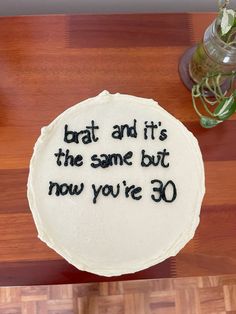 a cake that is sitting on top of a table with the words bat and it's the same but now you're 30