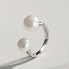 The ring is open, and there are two pearls on the ring, like a smiling mouth, with dimples. Material: S925 silver/natural pearl Size: Width about 3mm, the opening can be adjusted, pearls about 8mm / 9.5mm respectively Modern Pearl Ring, Smiling Mouth, Chanel Earrings, Natural Pearl, Open Design, Unique Gemstones, 925 Silver Jewelry, Swarovski Pearls, Recycled Gold