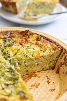 an omelet with broccoli and cheese in a pie pan on a table