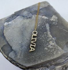 This 14k personalized diamond name necklace is the perfect gift for the bridal party, someone special, or yourself.* All letters are capital.__________________________________________M A T E R I A L & L E N G T HAvailable in 14k Yellow Gold, 14k Rose Gold, 14k White Gold, Sterling SilverThickness: 1.2mm / 0.05"InitialsLowercase: 4 mmCapital: 8 mmDiamond: 0.10 ct. - 0.30 ct. depending on the nameColor: GQuality: SI-VSAdditional Notes:• Non-Conflict Diamonds• Made in the USA Personalized Diamond Necklace For Birthday, Custom Name Fine Jewelry Nameplate Necklace, Custom Nameplate Necklace In Fine Jewelry Style, Diamond Nameplate Necklace With Diamond Accents, Diamond Accent Nameplate Necklace, Personalized Diamond Nameplate Jewelry, Personalized Diamond Jewelry For Mother's Day, Diamond Nameplate Jewelry With Initials, Gift Diamond Accents Initial Pendant Name Necklace