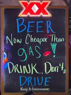 a sign that says beer now cheaper than oasis v drink, don't drive