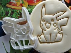 two cookie molds sitting next to each other