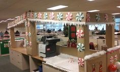 an office cubicle decorated for christmas with candy canes on the ceiling and decorations