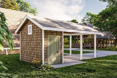 a small wooden shed sitting in the grass