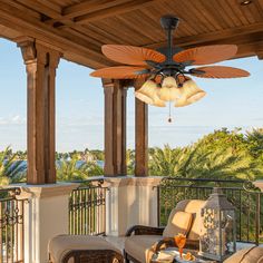 an outdoor patio with furniture and ceiling fan