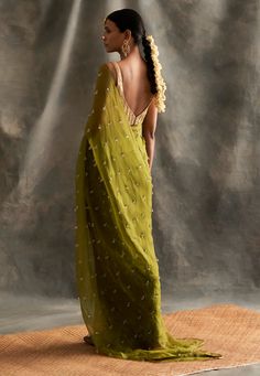 Editor's Note Pure Crepe Floor Length Kaftan With Handmade Lampi Triangles Embroidered All Over As Well As Edged At The Border Fabric: Crepe Color: Olive Green Care: Dry Clean Only About the Designer Itrh makes a high-end luxury Indian ethnic wear made using exquisite and endangered age-old crafts such as kalamkari, madhubani, chikankari, zardozi, and gota weaving. The focus of the house is to cherish the beauty of handcrafted luxury designer wear. Olive Green Saree, Organza Saree With Blouse, Green Sari, Blouse Yoke, Organza Blouse, Saree Silk, Green Saree, Embroidered Neckline, Organza Saree