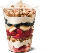 two cups filled with yogurt, fruit and granola on top of each other