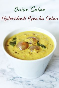 a close up of a bowl of food on a table with the words onion salam